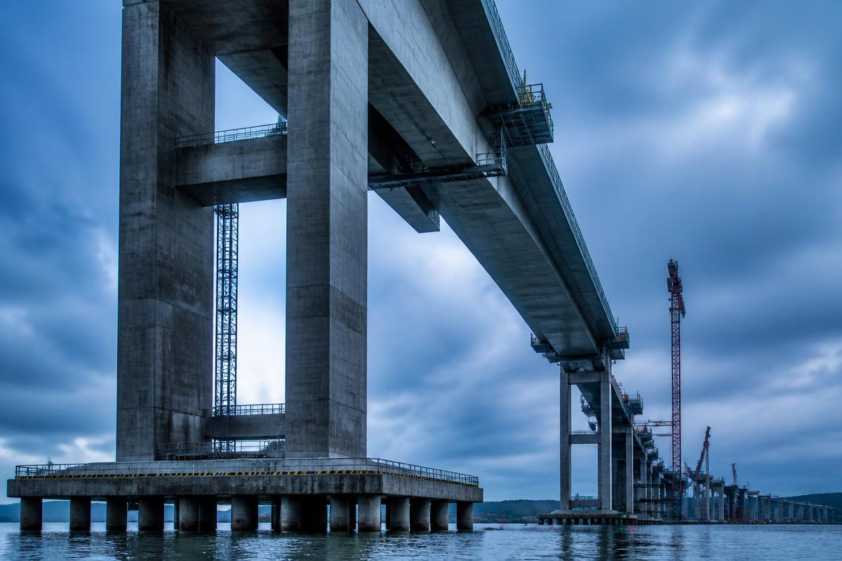 Concrete bridge piers under construction over water